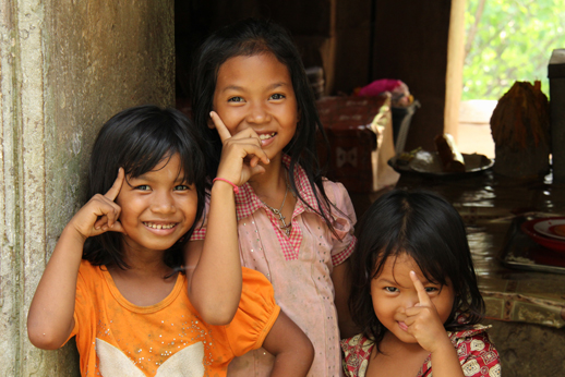 Three playful girls in the ruins of a temple, Battambang Province, Cambodia (Oct 2012)
